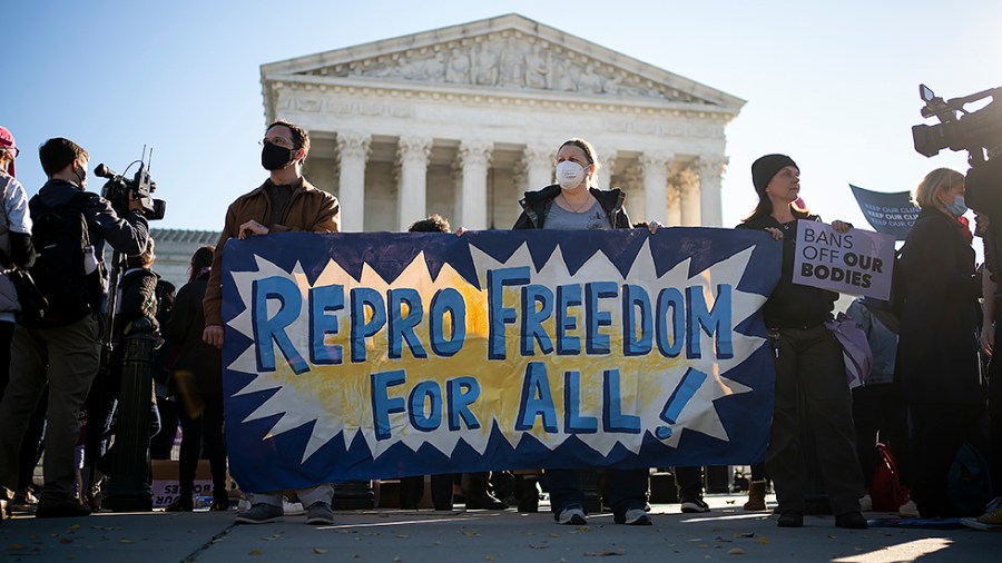 Pro-choice activists demonstrate outside the Supreme Court in Washington, D.C., Monday, November 11, 2021 as the court hears oral arguments for Whole Woman’s Health v. Jackson and United States v. Texas regarding the Texas abortion laws.