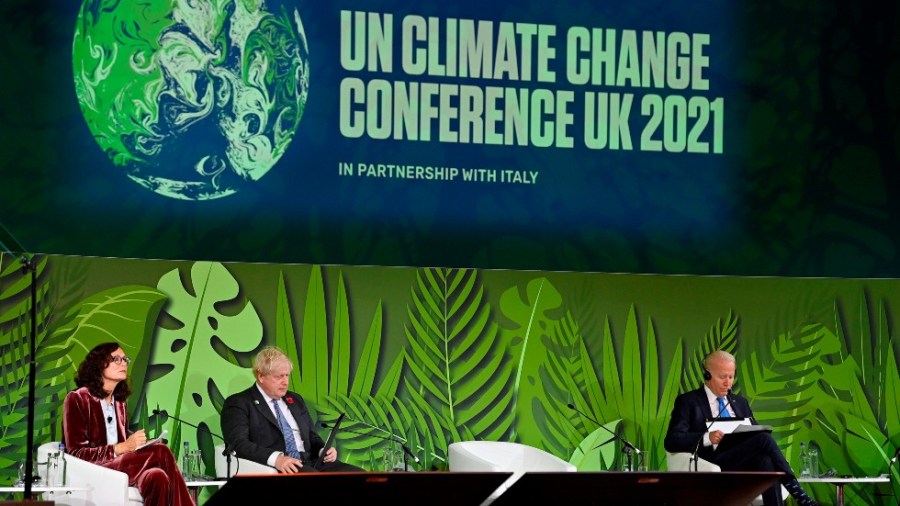 Britain's Prime Minister Boris Johnson, second from left, and U.S. President Joe Biden, right, attend a session on Action on Forests and Land Use