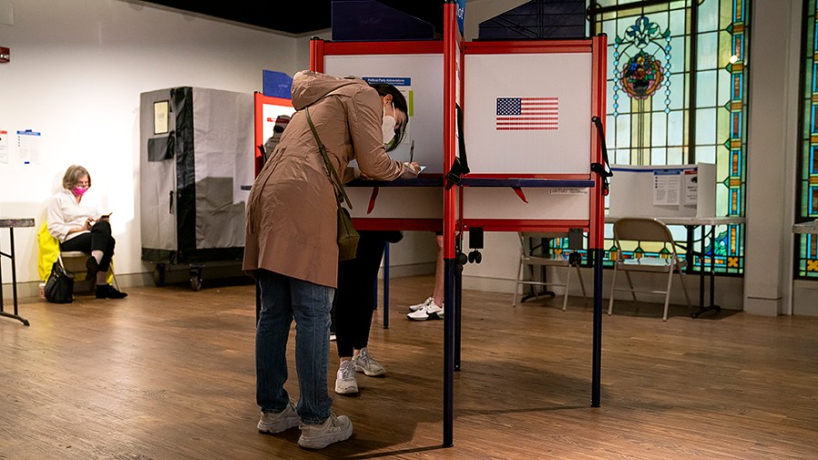 A person votes at the Arlington Arts Center in Arlington, Va., on Tuesday, November 2, 2021. Virginia is voting for governor, state house and senate races.