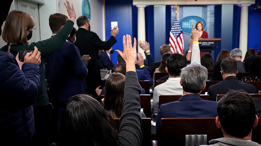 Reporters attempt to get called on by White House press secretary Jen Psaki during the daily briefing at the White House on Monday, November 15, 2021.