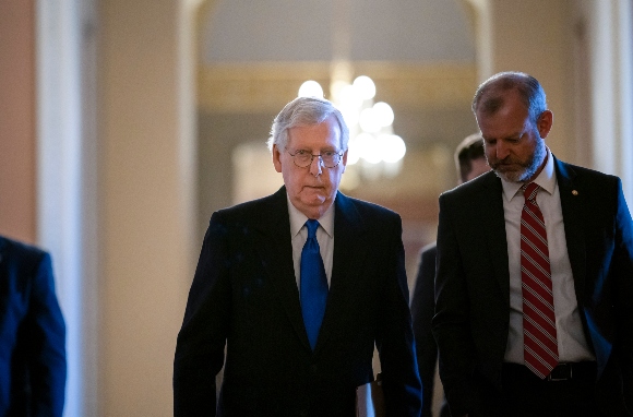 Senate Minority Leader Mitch McConnell, R-Ky., walks to the chamber