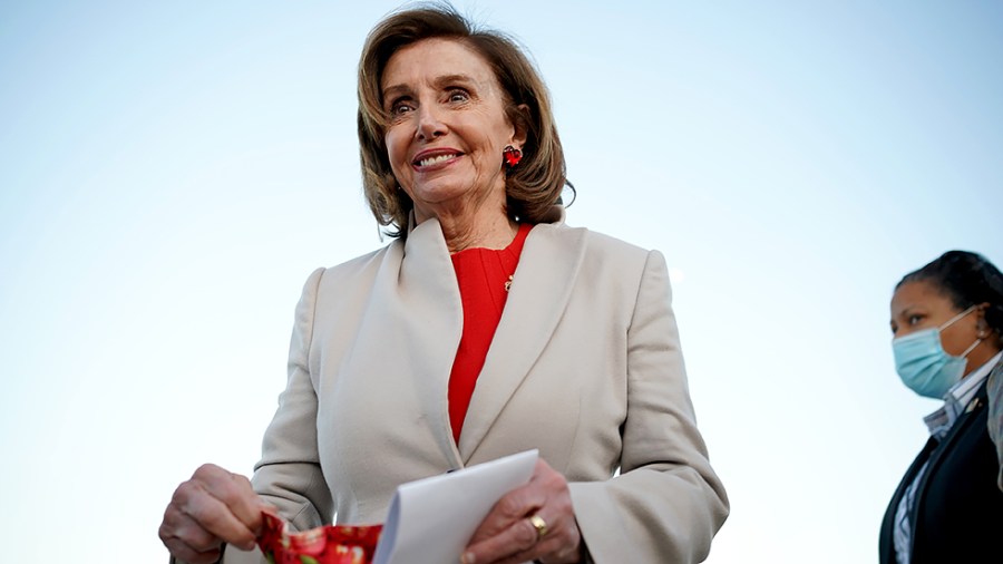 Speaker Nancy Pelosi (D-Calif.) leaves a rally to promote childcare in the Build Back Better Act at the Reflecting Pool of the Capitol on Tuesday, December 14, 2021.