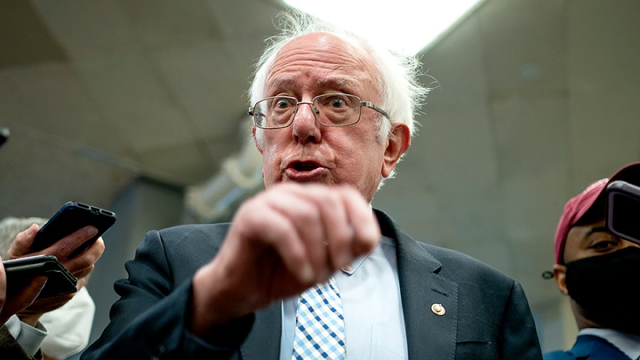 Sen. Bernie Sanders (I-Vt.) speaks to reporters as he arrives to the Capitol for a series of votes including the final passage of the National Defense Authorization Act and a judicial nomination on Wednesday, December 15, 2021.