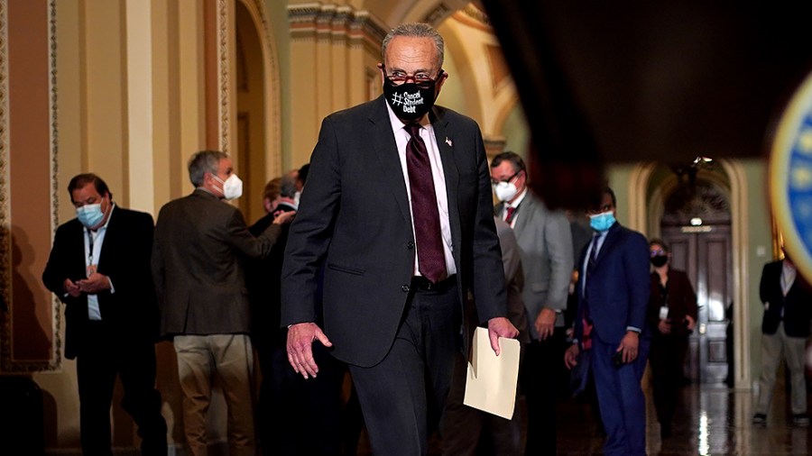 Majority Leader Charles Schumer (D-N.Y.) arrives for a press conference after the weekly policy luncheon on Tuesday, December 7, 2021.