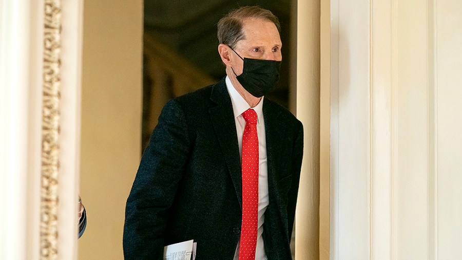 Sen. Ron Wyden (D-Ore.) arrives for a Senate Democratic luncheon on Friday, December 17, 2021 to discuss the way forward on the legislative agenda.