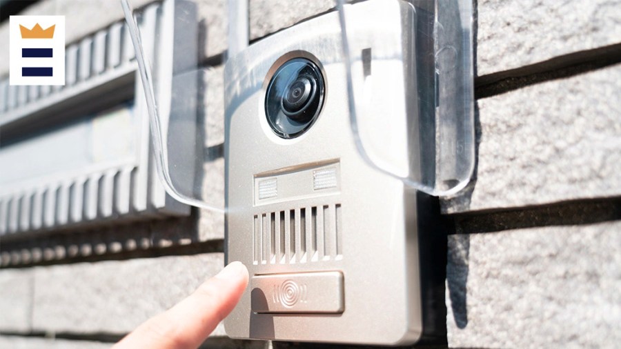 Person checking their wireless doorbell system