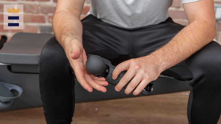 Man using the Vybe massage gun