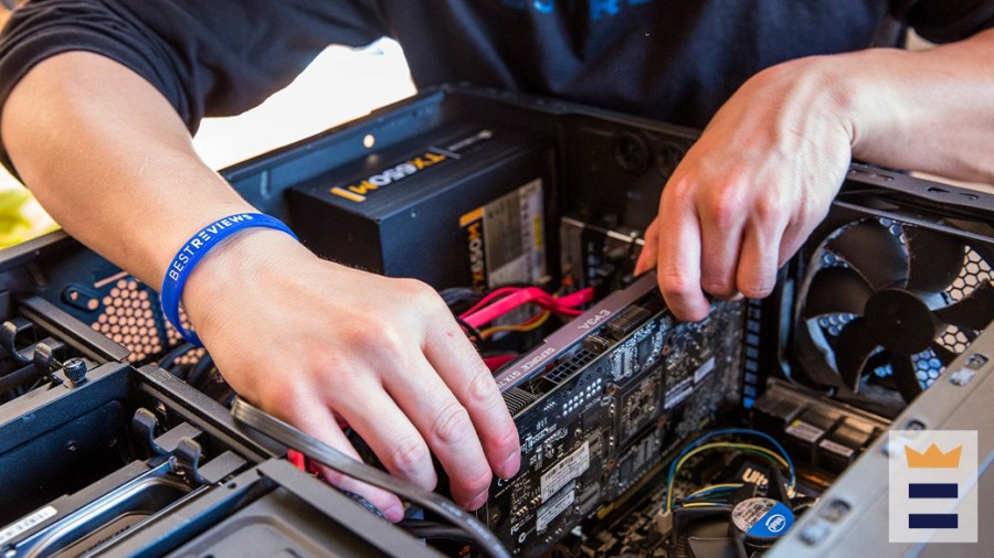 Person working on the internal components of a desktop computer