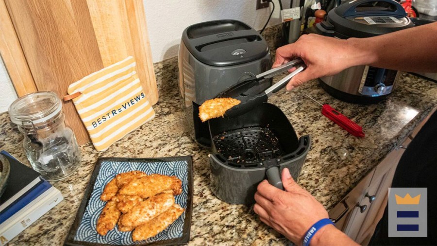 Person cooking with an air fryer making homemade beyond meat KFC chicken