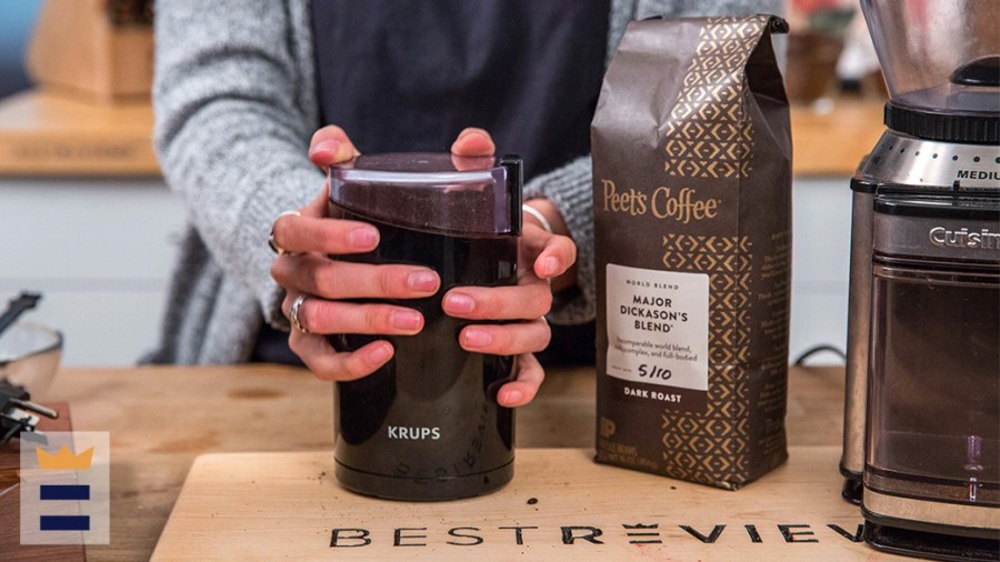 Person using a coffee grinder to prepare Peet's coffee