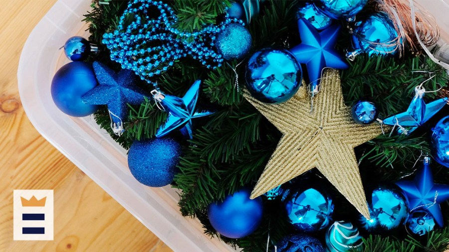 Blue holiday ornaments and a gold star ornament