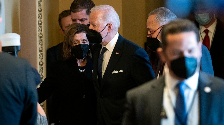 President Biden, Speaker Nancy Pelosi (D-Calif.) and Majority Leader Charles Schumer (D-N.Y.) arrive to the Mansfield Room to speak to family of the late Sen. Harry Reid (D-Nev.) as he lies in state in the Capitol Rotunda on Wednesday, January 12, 2022.