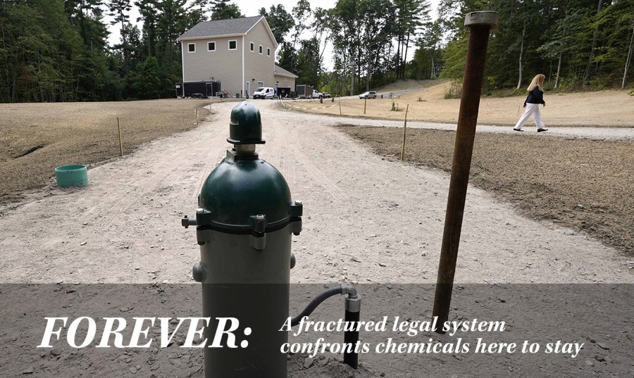 New Hampshire Rep. Nancy Murphy, D-Merrimack, walks through the under-construction water filtration site for two of her town's contaminated wells