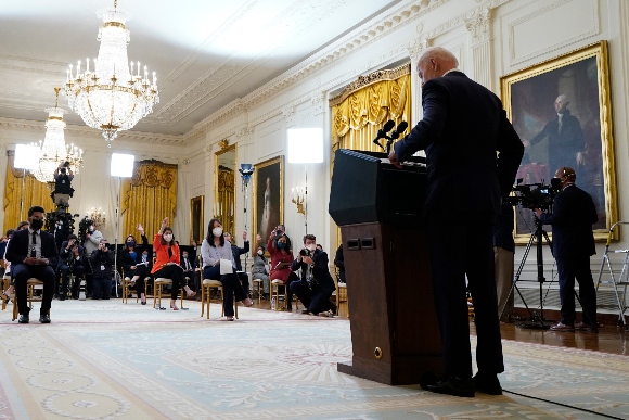 President Joe Biden speaks during a news conference in the East Room of the White House