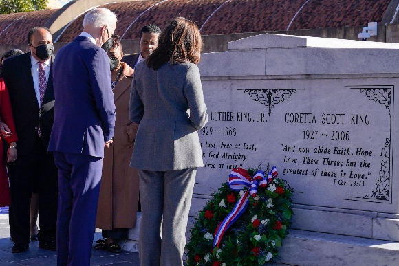 President Joe Biden and Vice President Kamala Harris pause after a wreath laying at the tomb of the Rev. Martin Luther King Jr., and his wife Coretta Scott King