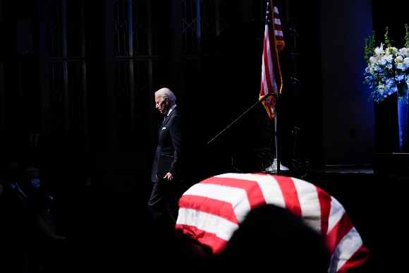 President Joe Biden walks by the flag-draped casket of former Senate Majority Leader Harry Reid