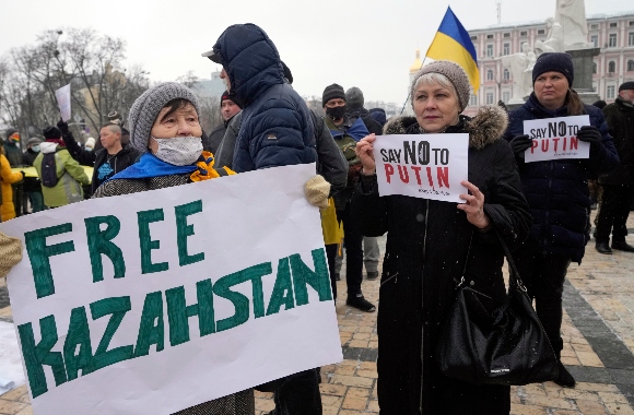 Activists hold posters during a SayNOtoPutin rally in Kyiv, Ukraine