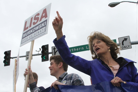 U.S. Sen. Lisa Murkowski, R-Alaska, campaigning at a busy street corner in Anchorage