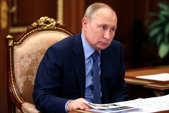 Russian President Vladimir Putin listens during a meeting at the Kremlin