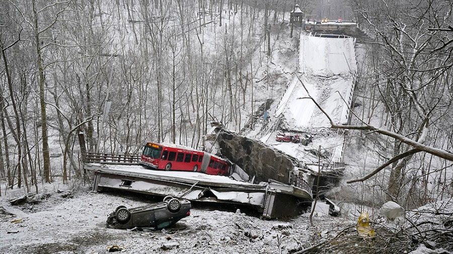 A Port Authority bus that was on a bridge when it collapsed Friday Jan. 28, 2022, is visible in Pittsburgh's East End.