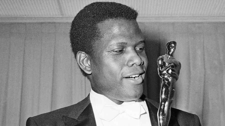 Sidney Poitier is seen with his Oscar on April 13, 1964