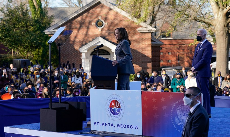 Vice President Harris speaks before President Biden at an event for voting rights in front of a crowd