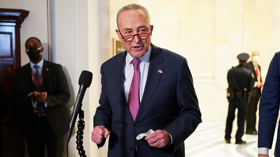 Majority Leader Charles Schumer (D-N.Y.) speaks to reporters after hearing from President Biden at a Democratic caucus luncheon at the Senate Russell Office building to discuss voting rights and filibuster reform on Thursday, January 13, 2022.