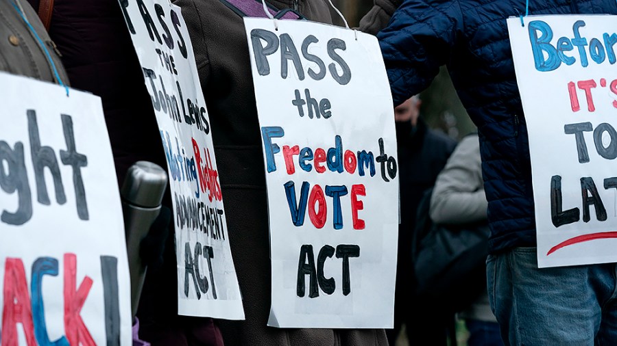 Pro-Democratic supporters are seen during a vigil to mark the first anniversary of the attack on the Capitol and to support voting rights on Thursday, January 6, 2022.