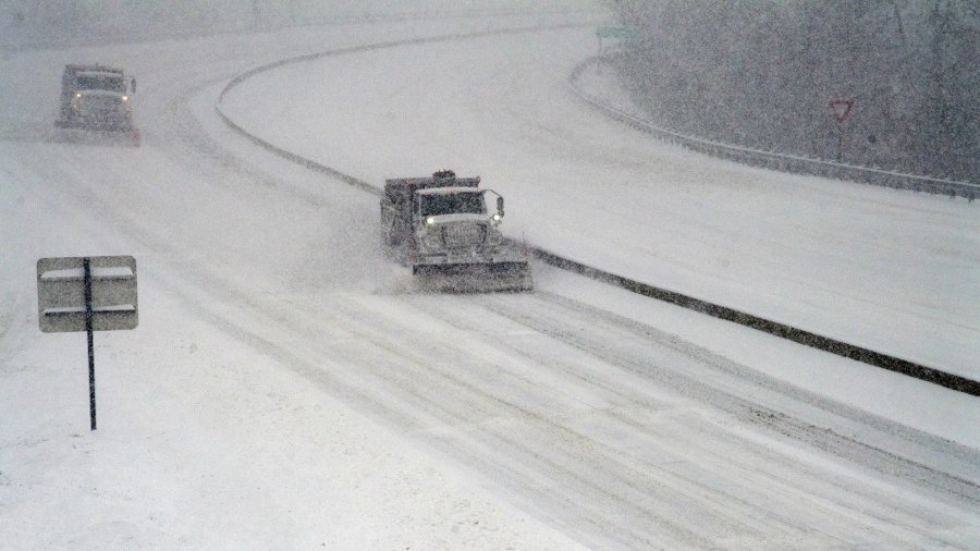 Virginia Department of Transportation snowplows attempt to keep I-581 clear for motorists during a winter storm