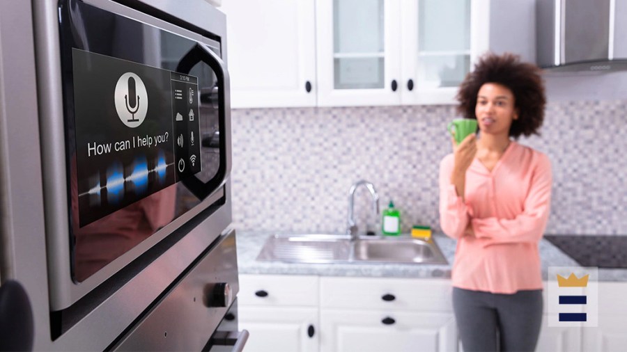 Woman in the kitchen admiring her smart microwave