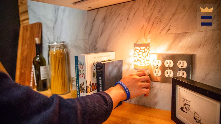 Person unplugging a nightlight in their kitchen