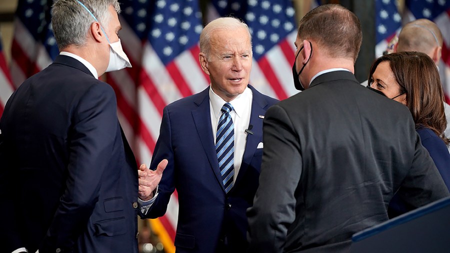 President Biden speaks to Secretary of Labor Marty Walsh after an event to sign an executive order regarding project labor agreements at Irownworks Local 5 in Upper Marlboro, Md., on Friday, February 4, 2022.