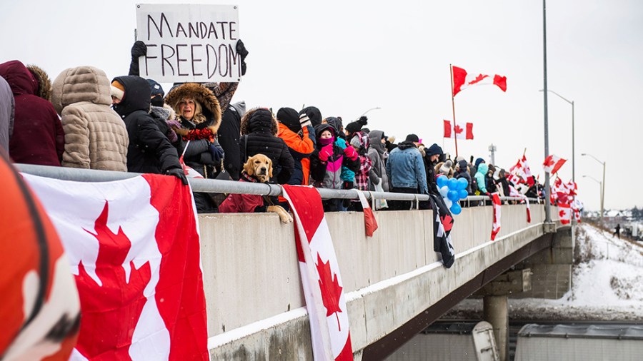 People protest on a bridge in Canada