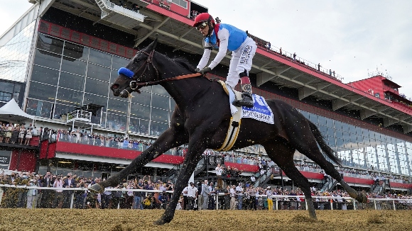 John Velazquez atop Medina Spirit competes during the 146th Preakness Stakes horse race