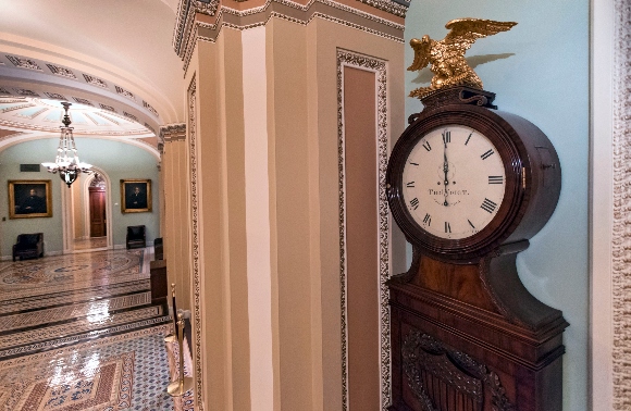 Just off the floor of the Senate, the hands on the famous Ohio Clock point to 12 midnight