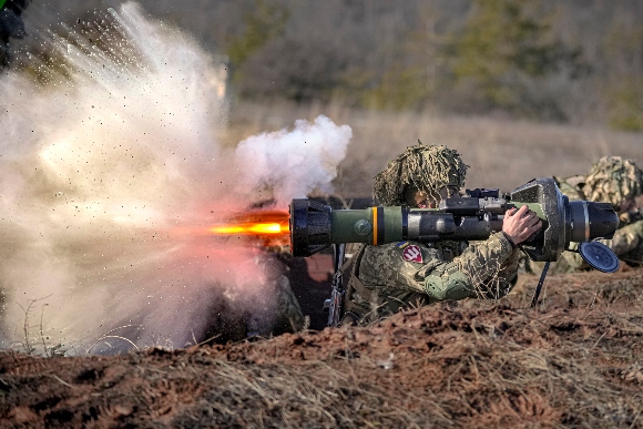 A Ukrainian serviceman fires an NLAW anti-tank weapon during an exercise