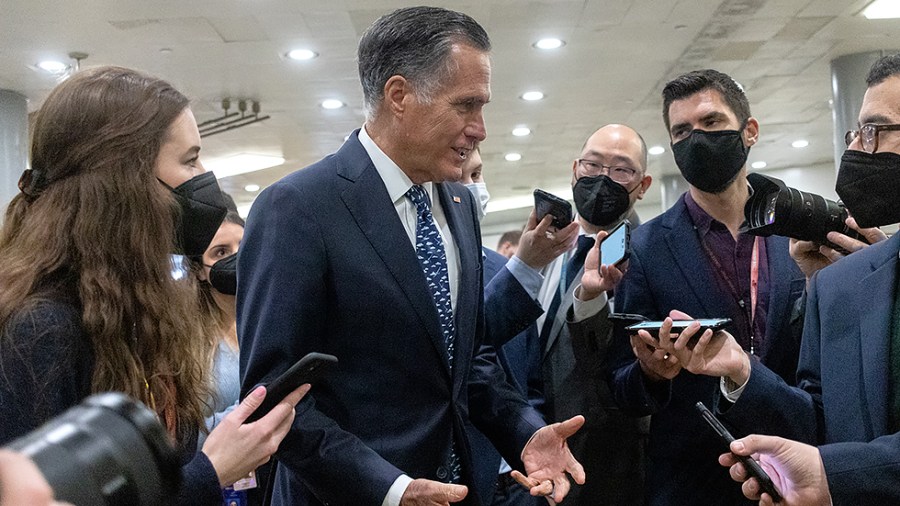 Sen. Mitt Romney (R-Utah) is questioned by reporters beneath the Senate prior to the vote on the nomination of Robert Califf to be Commissioner of the Food and Drug Administration on Tuesday, February 15, 2022.