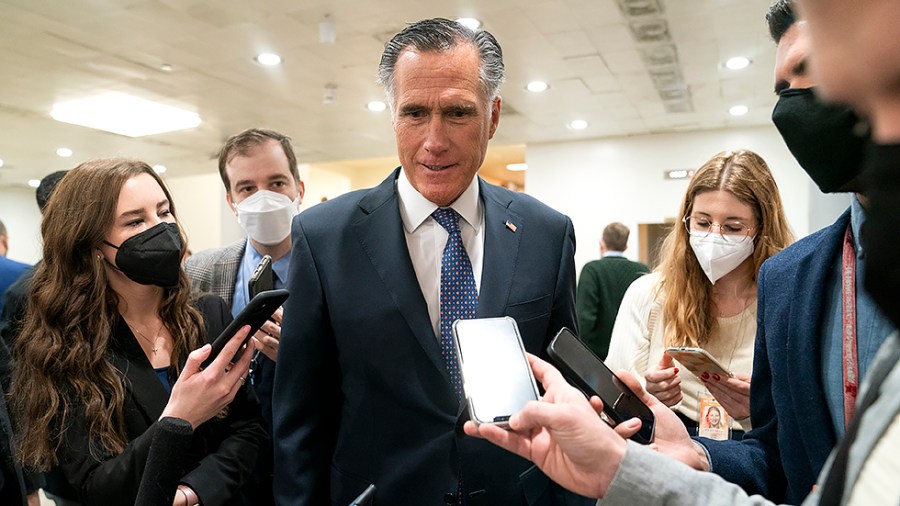 Sen. Mitt Romney (R-Utah) speaks to reporters in the basement of the Capitol in between procedural votes regarding Department of Defense nominations on Wednesday, February 16, 2022.