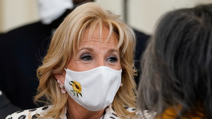 First lady Jill Biden wears a mask with a sunflower, the national flower of Ukraine, in support of the Ukrainian people