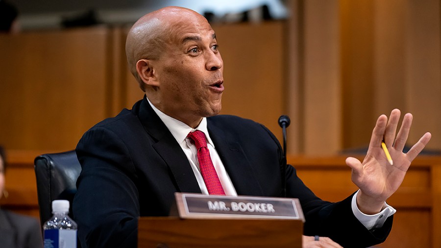 Sen. Cory Booker (D-N.J.) speaks with Supreme Court nominee Ketanji Brown Jackson during the third day of her Senate Judiciary Committee confirmation hearing on Wednesday, March 23, 2022.