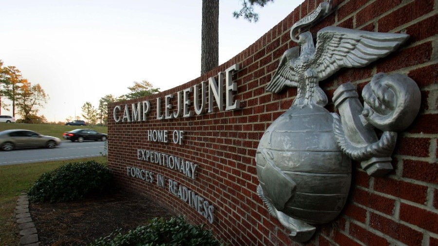 Cars enter the main gate at Camp Lejeune in Jacksonville, N.C.