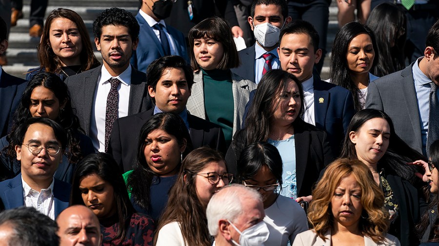 Congressional staffers arrive for a press event to mark the one-year anniversary of the Atlanta spa shootings on Wednesday, March 16, 2022.