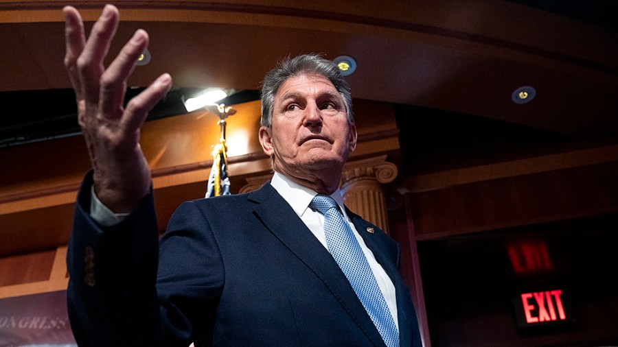 Sen. Joe Manchin (D-W.Va.) speaks to reporters following a press conference on Thursday, March 3, 2022 to introduce the Banning Russian Energy Imports Act.