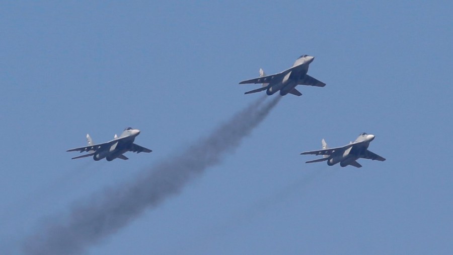 Serbian Army MiG-29 jet fighters perform during ceremony in Batajnica