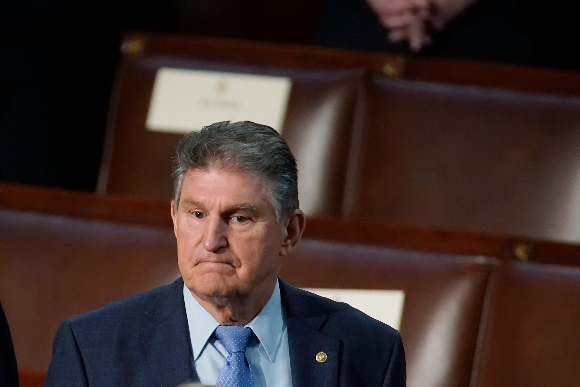 Sen. Joe Manchin, D-W.Va., arrives to hear President Joe Biden deliver his State of the Union address