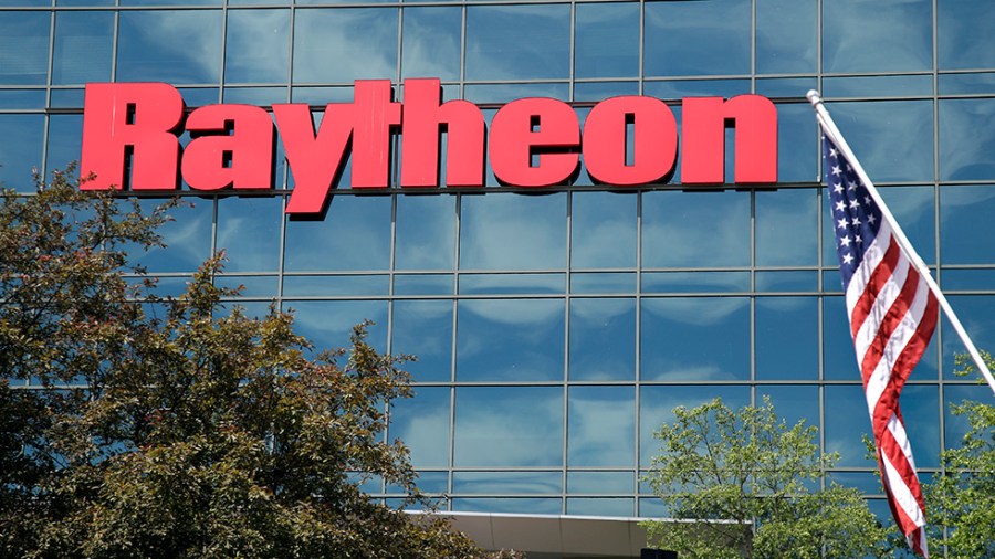 The Raytheon logo is displayed on a building