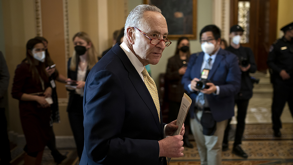 Majority Leader Charles Schumer (D-N.Y.) leaves a press conference following the Democratic policy luncheon on Tuesday, March 1, 2022.