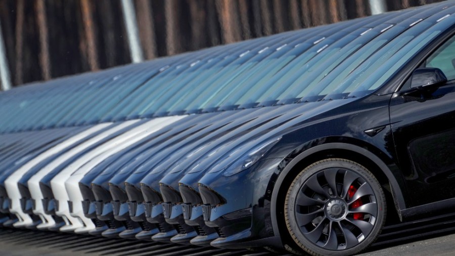 Tesla cars are parked at the construction site of the new Tesla Gigafactory for electric cars in Gruenheide near Berlin, Germany