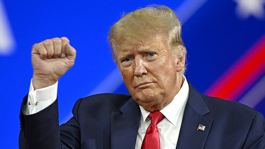 President Donald Trump pumps his fist following his speech at the Conservative Political Action Conference in Orlando, Fla., on Saturday, February 26, 2022.