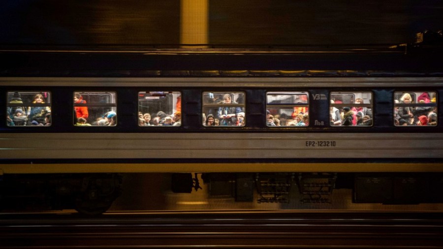 A train with refugees fleeing Ukraine crosses the border in Medyka, Poland